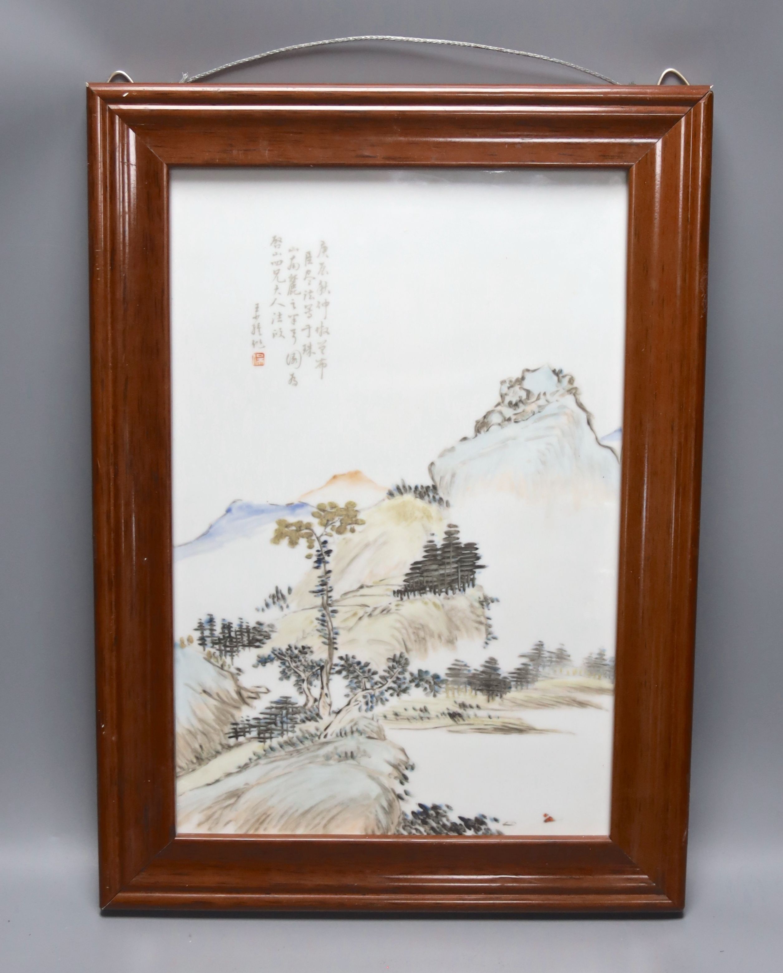 A Chinese porcelain plaque, landscape design with script, 37 x 25cm, in frame